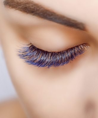 Eyelash Extension Procedure. Woman Eye with Long Eyelashes. Lashes. Close up, macro, selective focus