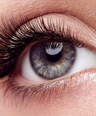 Female Eye with Extreme Long False Eyelashes. Eyelash Extensions. Makeup, Cosmetics, Beauty. Close up, Macro